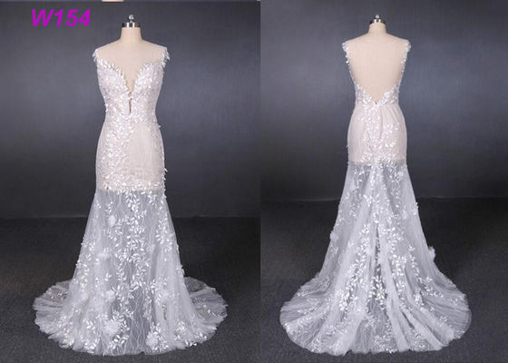 I vestiti da sposa trasparenti dall'applicazione del pizzo di Tulle hanno personalizzato prefabbricato